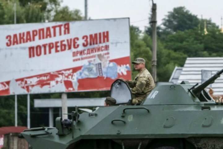 150713102725_an_interior_ministry_serviceman_sits_on_top_of_an_armoured_personnel_carrier_apc_at_the_scene_of_a_shootout_near_mukacheve13072015_reuters_640x360_reuters_nocredit